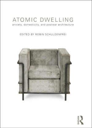 The front cover of 'Atomic Dwelling: Anxiety, domesticity, and postwar architecture', edited by Robin Schuldenfrei. The cover has a white background and minimal grey text, with a concrete armchair in a square, post-war design in the middle of the page.