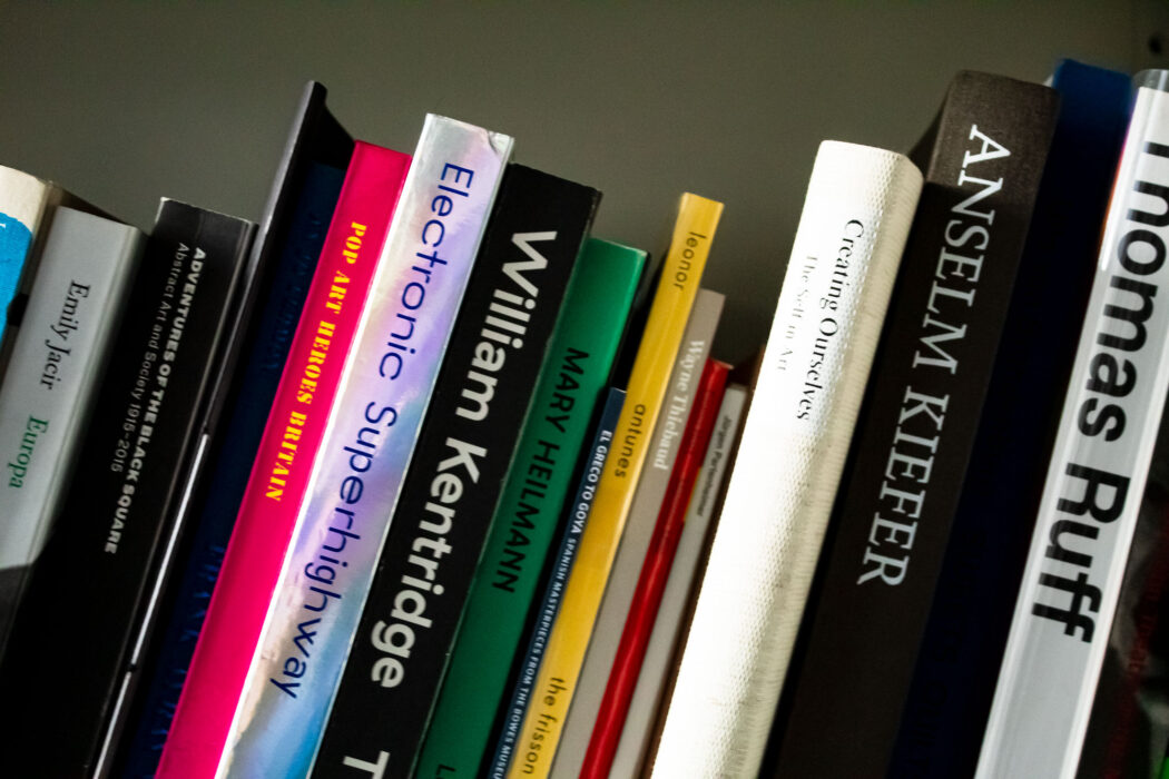 Collection of art books on library shelf
