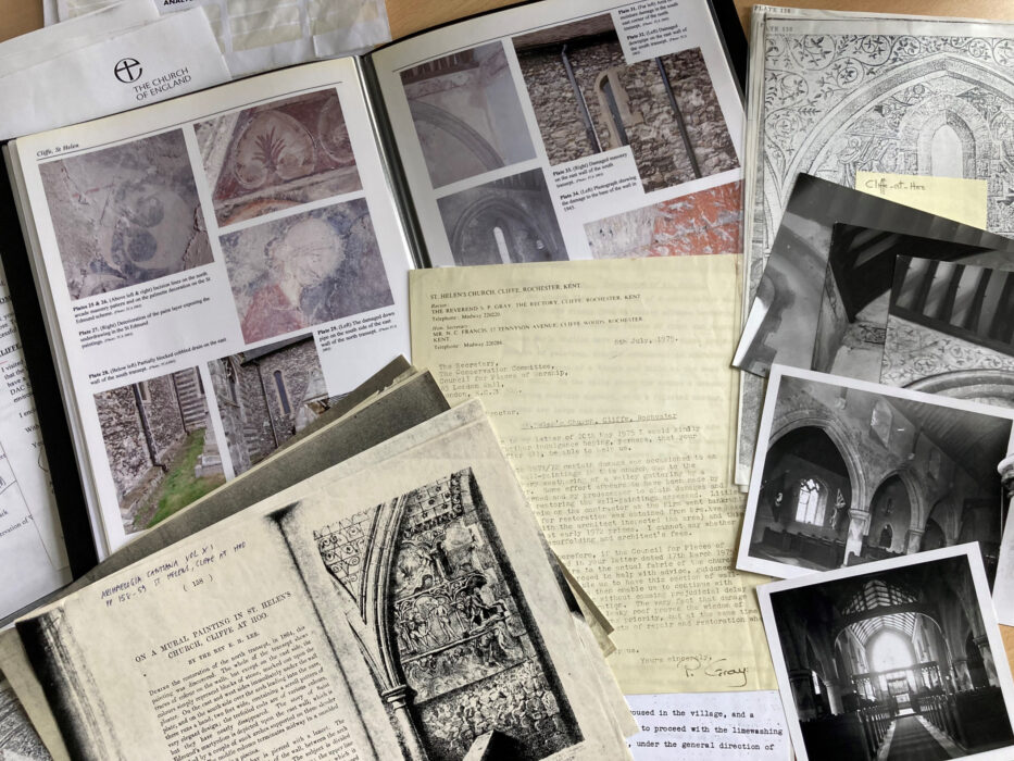 books and manuscripts showing old black and white images of architectural details of buildings